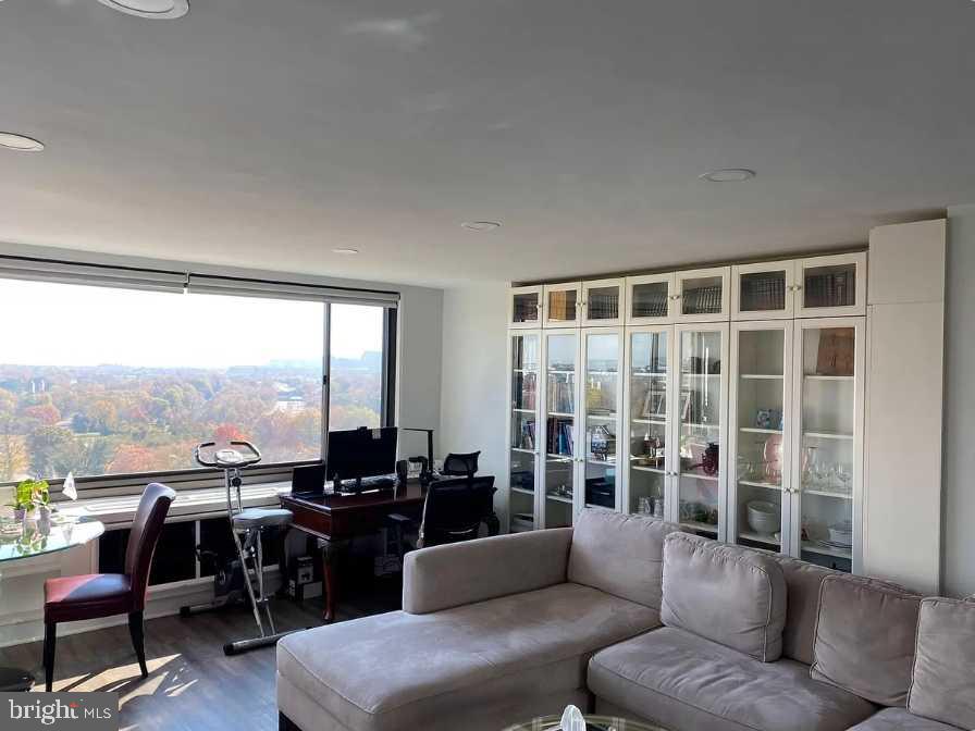1011 Arlington Boulevard, Unit 1030 Arlington, VA 22209 - Photo 7 of 26 a living room with furniture and a floor to ceiling window