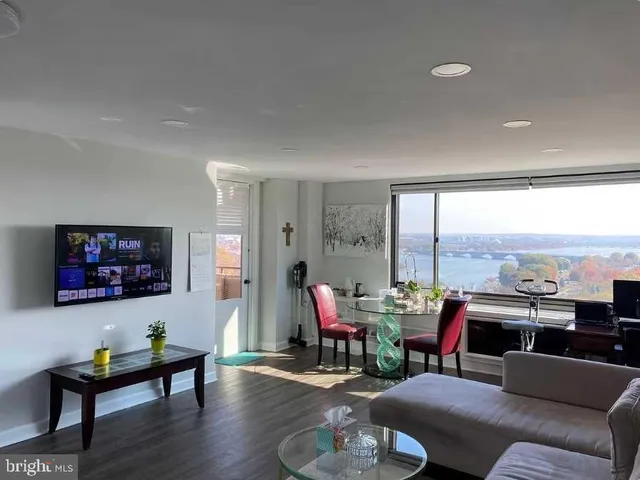 a kitchen with stainless steel appliances a sink stove and cabinets