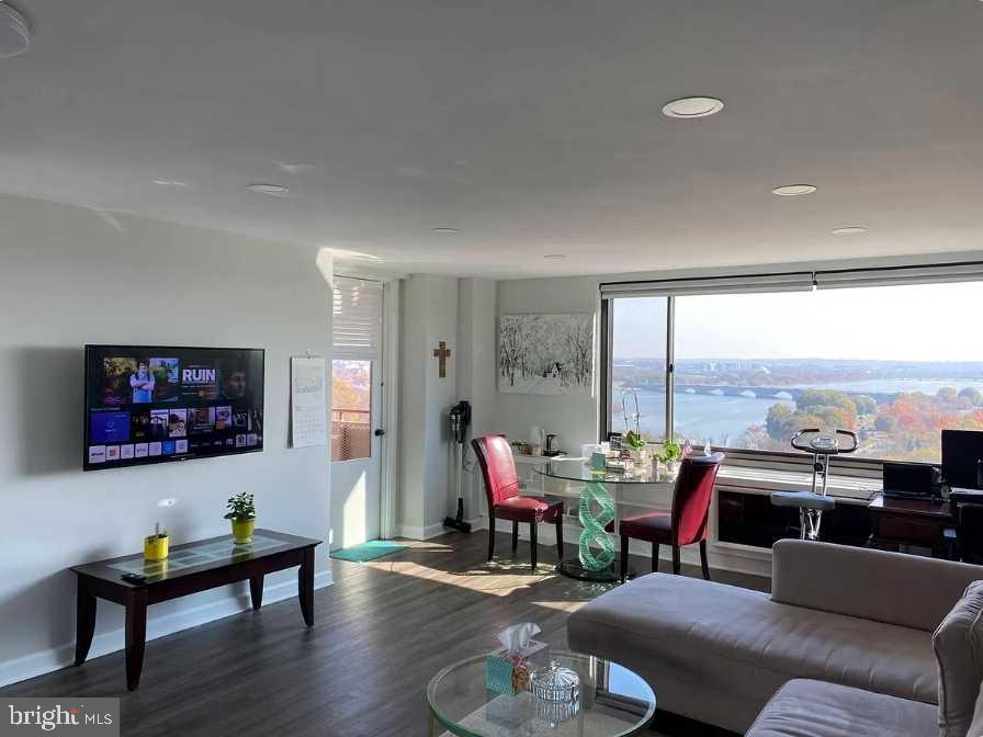 1011 Arlington Boulevard, Unit 1030 Arlington, VA 22209 - Photo 8 of 26 a living room with furniture and floor to ceiling window