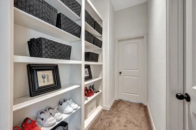 a bedroom with bed and a window