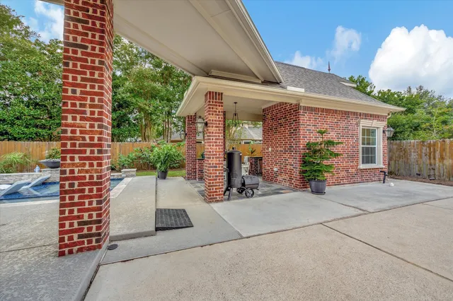 a view of a house with a backyard and a garage