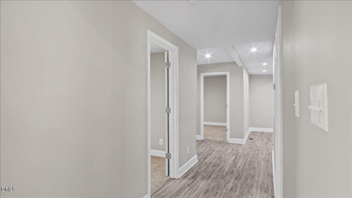 1284 Railroad Road Henderson, NC 27536 - Photo 13 of 35 a view of a hallway with wooden floor