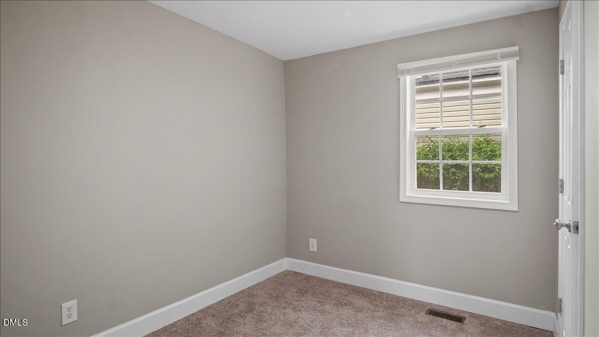 1284 Railroad Road Henderson, NC 27536 - Photo 17 of 35 an empty room with a window