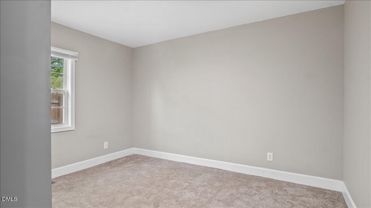 1284 Railroad Road Henderson, NC 27536 - Photo 20 of 35 an empty room with a window
