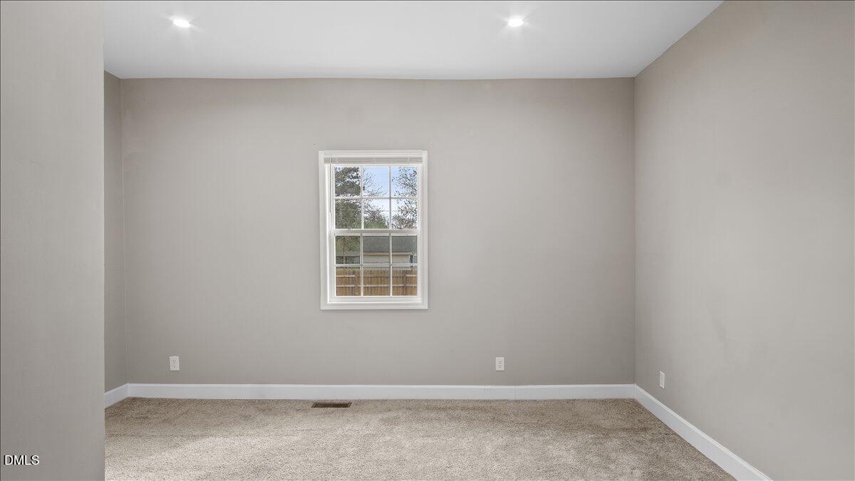 1284 Railroad Road Henderson, NC 27536 - Photo 23 of 35 an empty room with a window