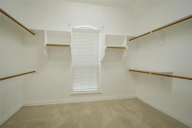 a bathroom with a sink a shower and a mirror