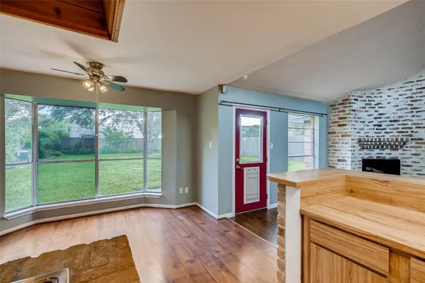 a view of empty room with ceiling fan