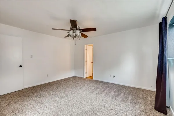 a view of a bathroom with a shower and closet