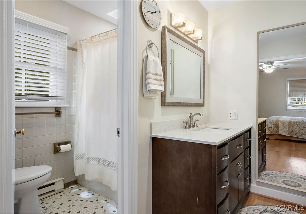 6412 Gaines Mill Road Mechanicsville, VA 23111 - Photo 18 of 33 a bathroom with a sink a toilet and a mirror