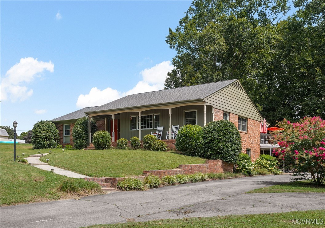 6412 Gaines Mill Road Mechanicsville, VA 23111 - Photo 2 of 33 a front view of a house with a yard and potted plants