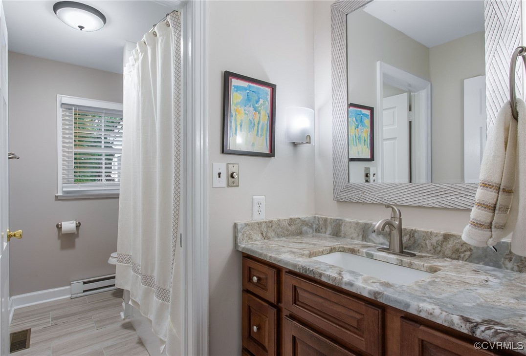6412 Gaines Mill Road Mechanicsville, VA 23111 - Photo 21 of 33 a bathroom with a granite countertop sink and a mirror