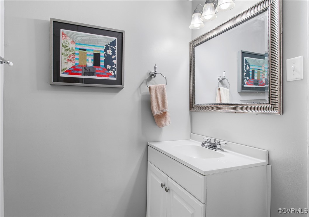 6412 Gaines Mill Road Mechanicsville, VA 23111 - Photo 27 of 33 a bathroom with a sink and a mirror