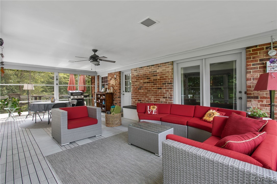 6412 Gaines Mill Road Mechanicsville, VA 23111 - Photo 29 of 33 a living room with furniture a large window and red rug