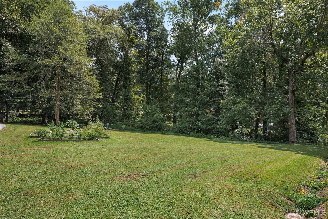6412 Gaines Mill Road Mechanicsville, VA 23111 - Photo 32 of 33 a view of a field with trees in the background