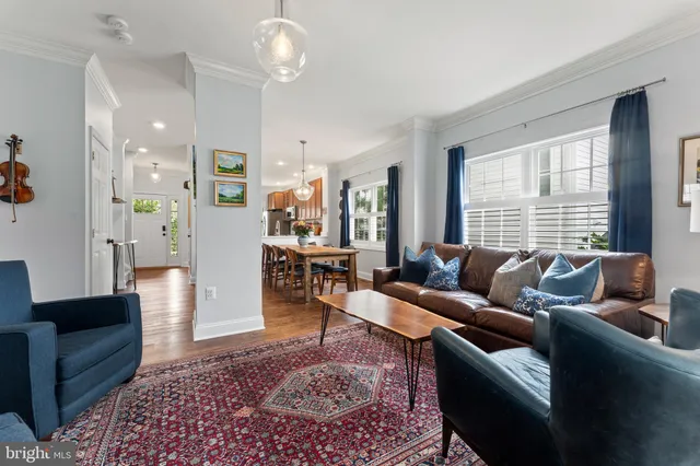 a living room with furniture and a rug