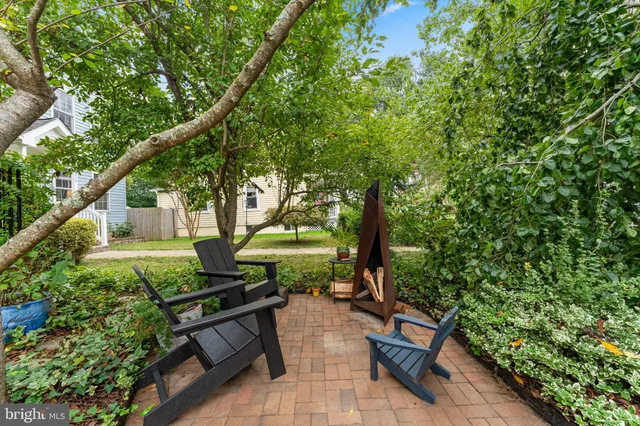 a view of a backyard with sitting area
