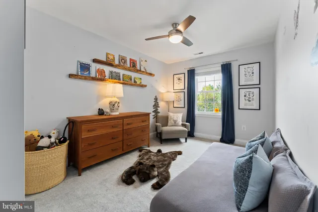 a bed room with furniture and a window
