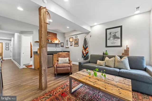 a kitchen with granite countertop a sink a stove and cabinets