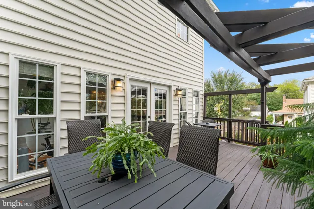 a view of balcony with wooden floor and outdoor seating
