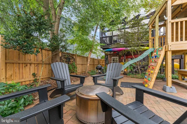 a view of a patio with a table and chairs