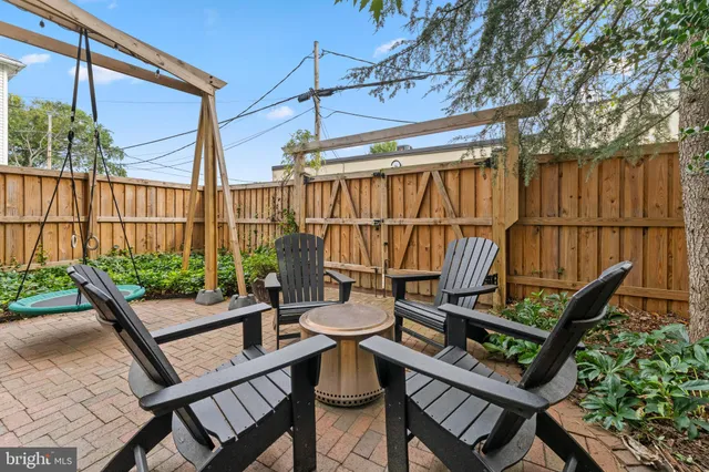 a view of a chairs and table in the patio