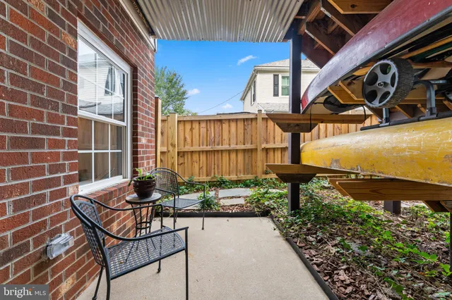 an outdoor sitting area with swimming pool