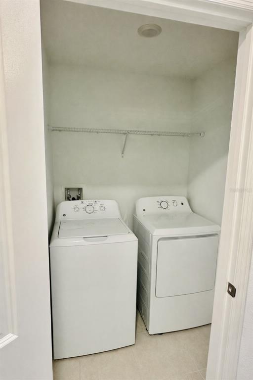 8271 Corner Pine Way New Port Richey, FL 34655 - Photo 11 of 16 a utility room with dryer and washer