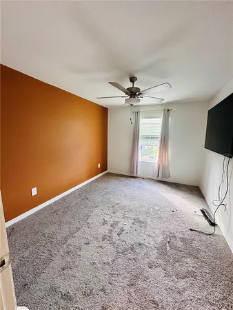 a view of an empty room with a fireplace