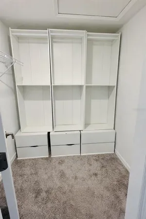 a view of an empty walk in closet