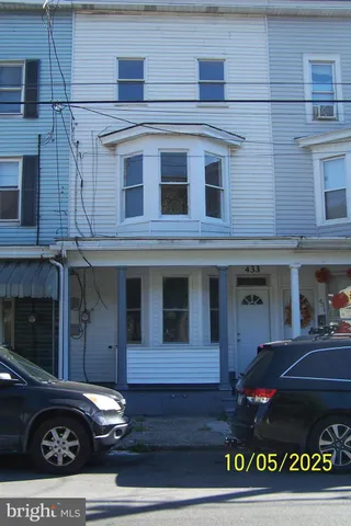 a view of a building that has a sign on the wall