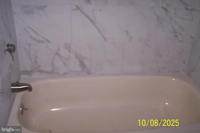 a picture of a bathroom with a shower