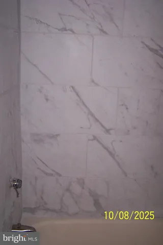 a view of a house with a small deck