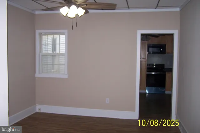 a kitchen with granite countertop a sink and a stove