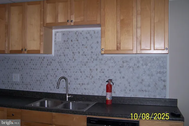 a kitchen with stainless steel appliances granite countertop a stove a refrigerator and a microwave