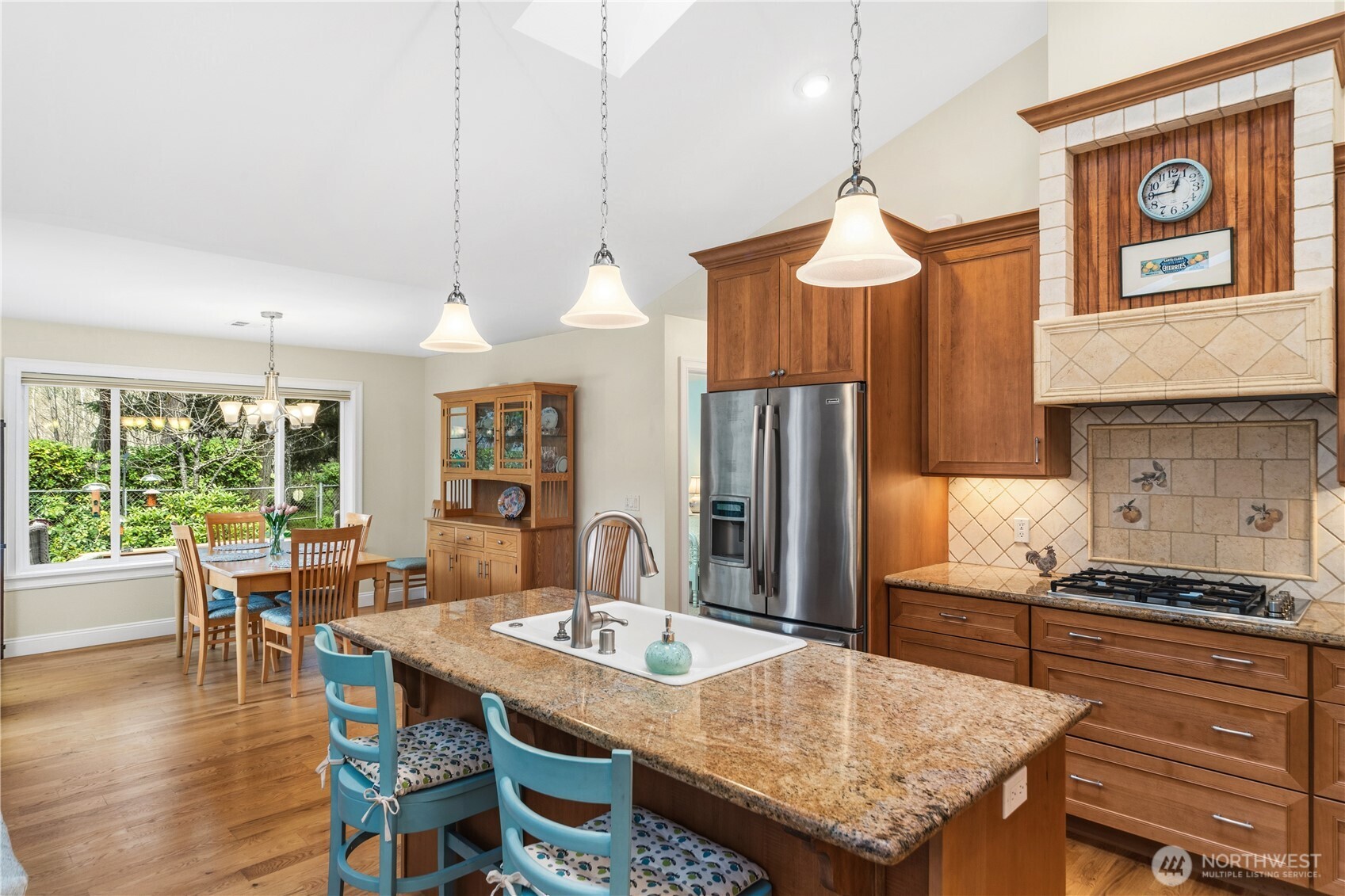 346 Dungeness Meadows Sequim, WA 98382 - Photo 11 of 36 a kitchen with a table chairs and flat screen tv