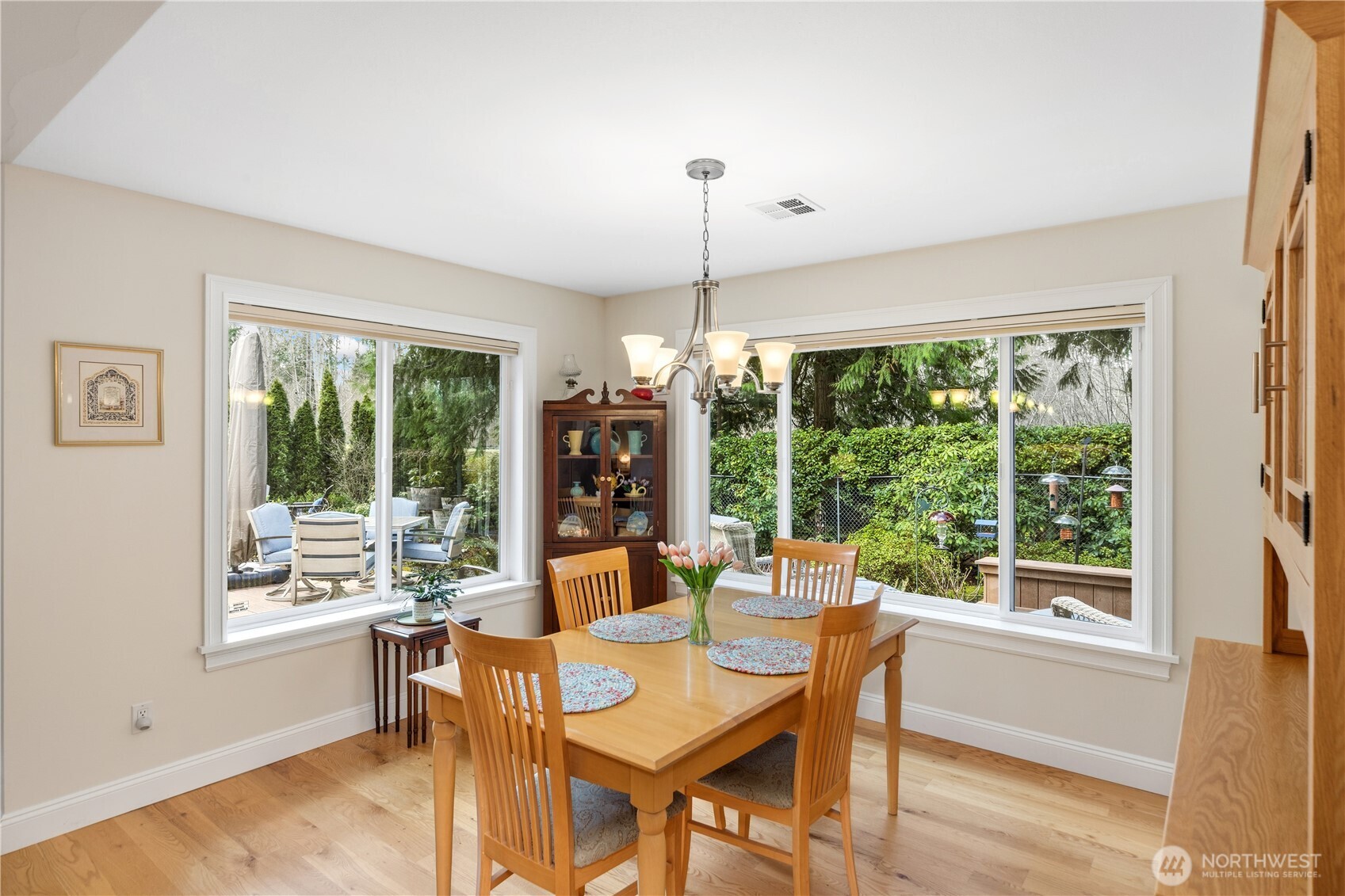 346 Dungeness Meadows Sequim, WA 98382 - Photo 12 of 36 a dining room with furniture a chandelier and wooden floor