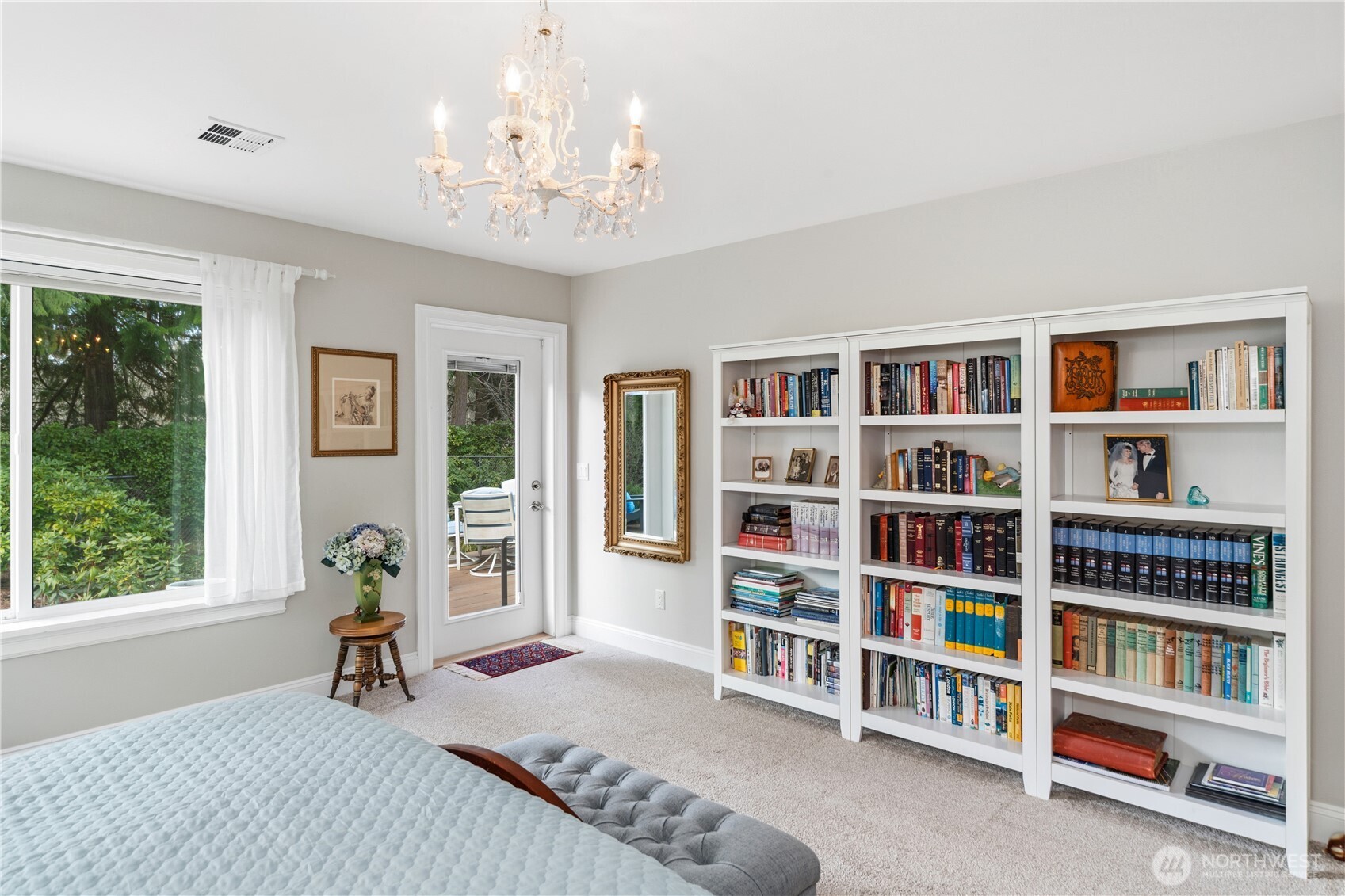 346 Dungeness Meadows Sequim, WA 98382 - Photo 14 of 36 a bedroom with furniture and a book shelf