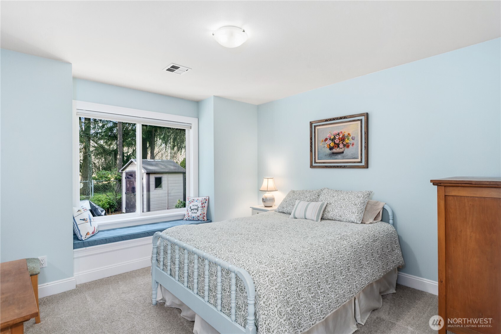 346 Dungeness Meadows Sequim, WA 98382 - Photo 19 of 36 a bedroom with a bed and a large window