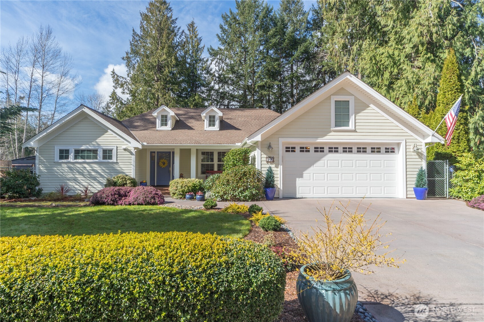 346 Dungeness Meadows Sequim, WA 98382 - Photo 2 of 36 a front view of a house with a yard and garage