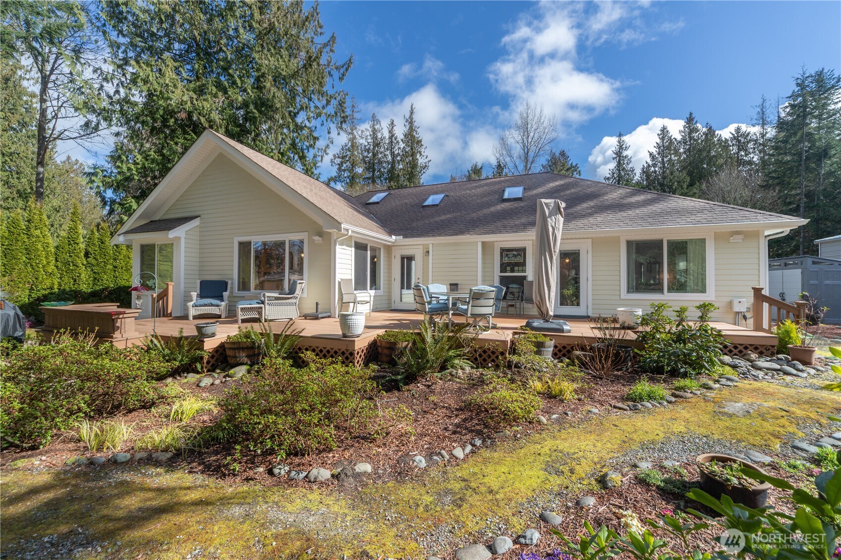 346 Dungeness Meadows Sequim, WA 98382 - Photo 23 of 36 a front view of house with yard and trees around