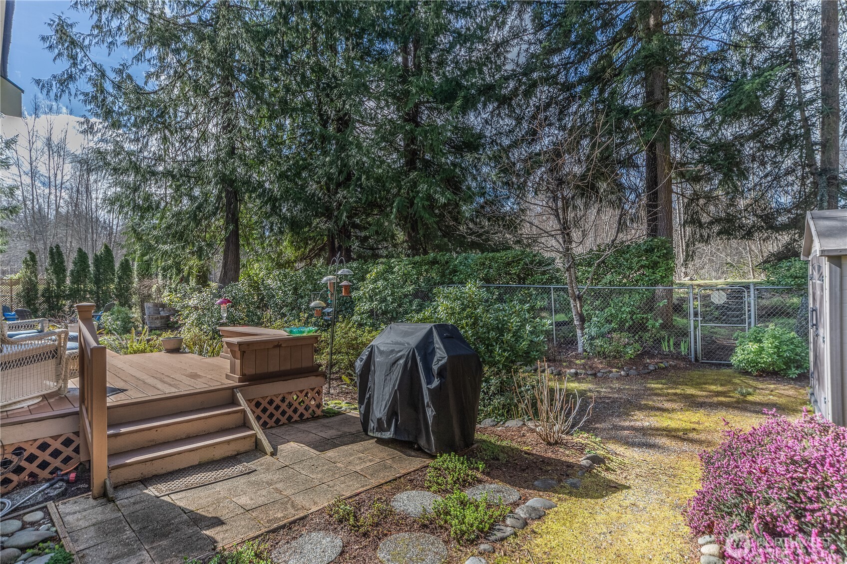 346 Dungeness Meadows Sequim, WA 98382 - Photo 24 of 36 a view of a patio with a table and chairs next to a yard