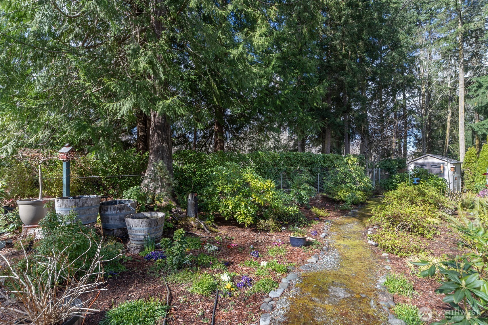 346 Dungeness Meadows Sequim, WA 98382 - Photo 27 of 36 a backyard of a house with outdoor seating