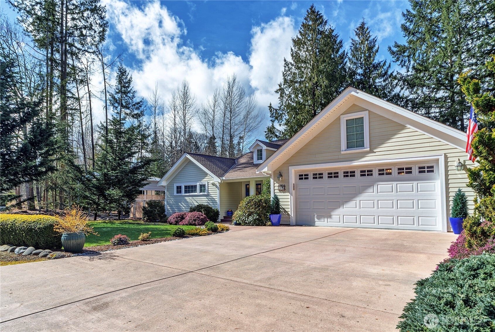 346 Dungeness Meadows Sequim, WA 98382 - Photo 3 of 36 a front view of a house with a garden