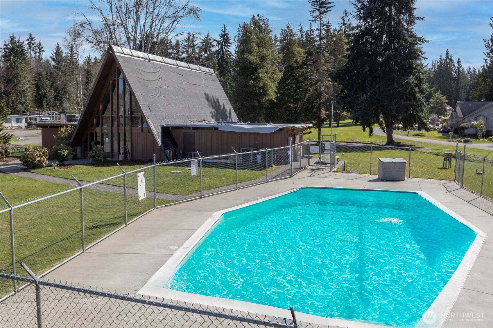 346 Dungeness Meadows Sequim, WA 98382 - Photo 35 of 36 a view of a swimming pool with a patio and a yard