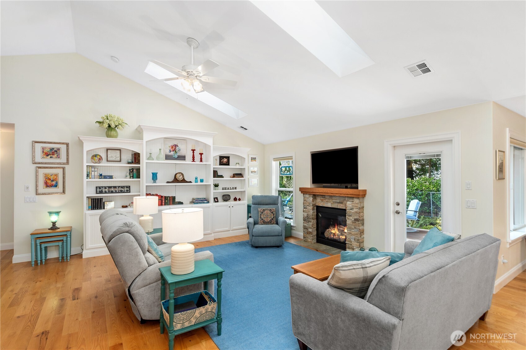 346 Dungeness Meadows Sequim, WA 98382 - Photo 7 of 36 a living room with fireplace furniture and a flat screen tv