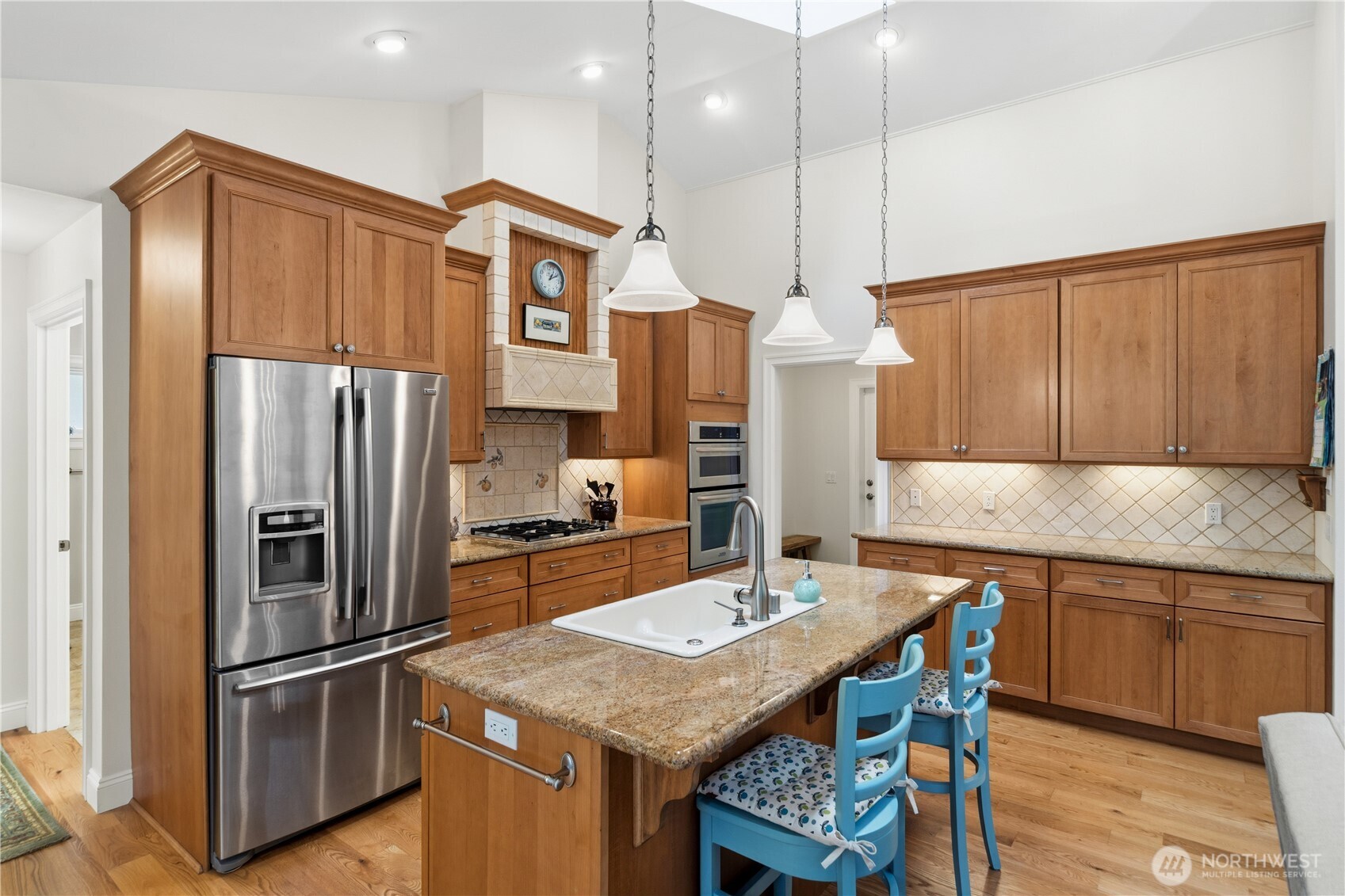 346 Dungeness Meadows Sequim, WA 98382 - Photo 10 of 36 a kitchen with stainless steel appliances granite countertop a sink refrigerator and cabinets