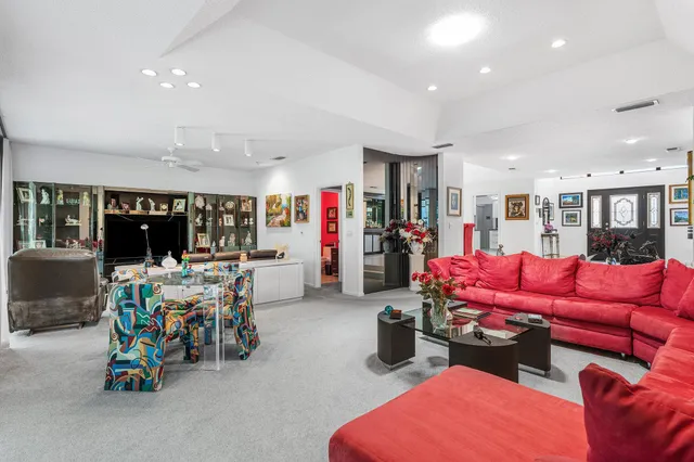 a kitchen with stainless steel appliances kitchen island granite countertop a sink and cabinets