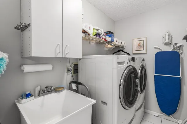 a living room with furniture and a ceiling fan
