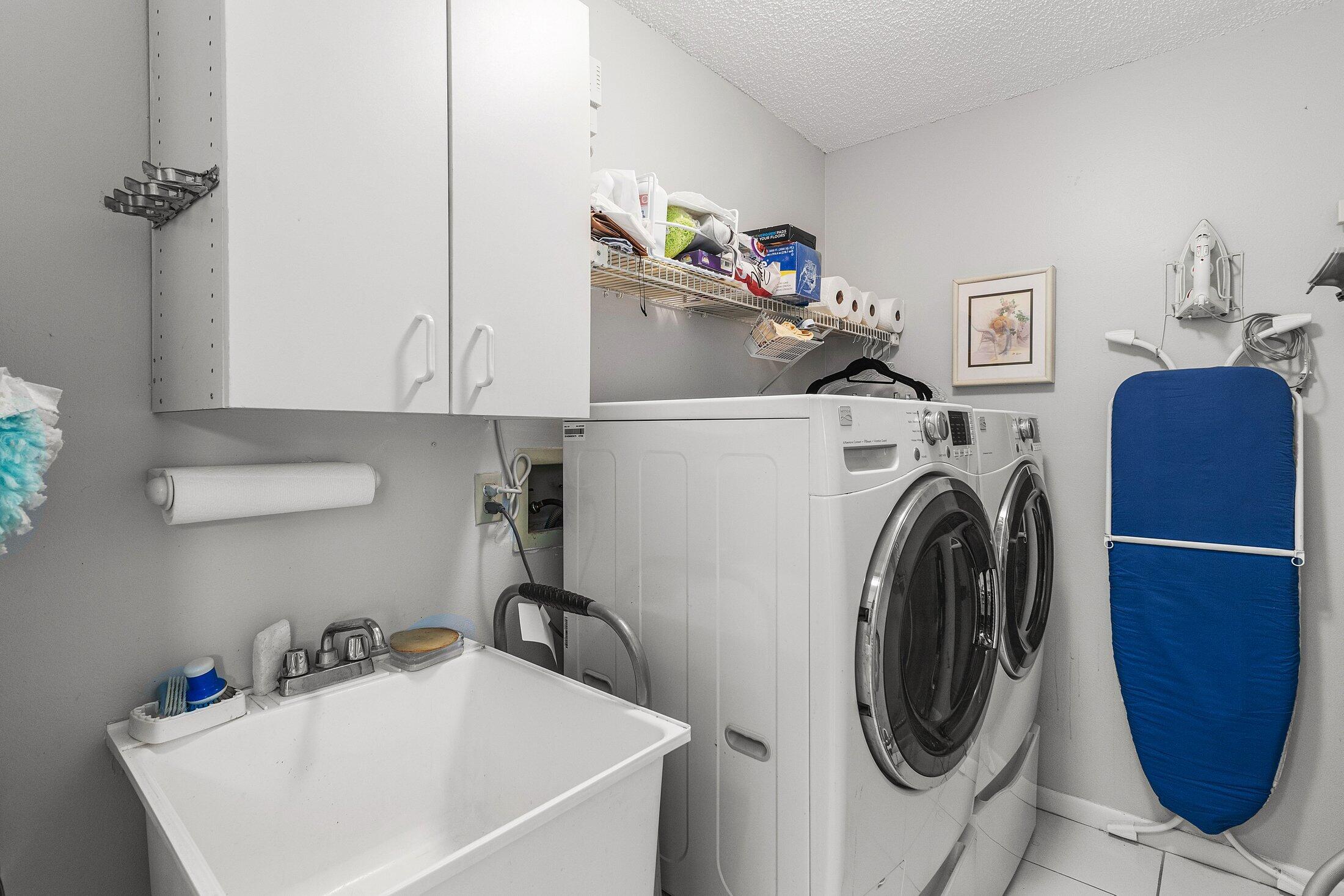 56 Woods Lane Boynton Beach, FL 33436 - Photo 20 of 77 a utility room with dryer and washer