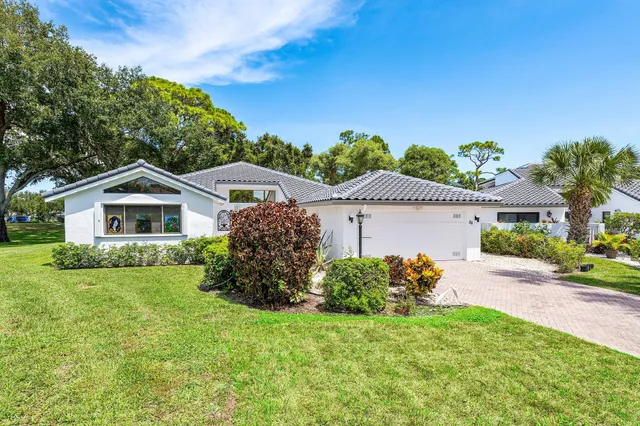a living room with furniture large window and flat screen tv